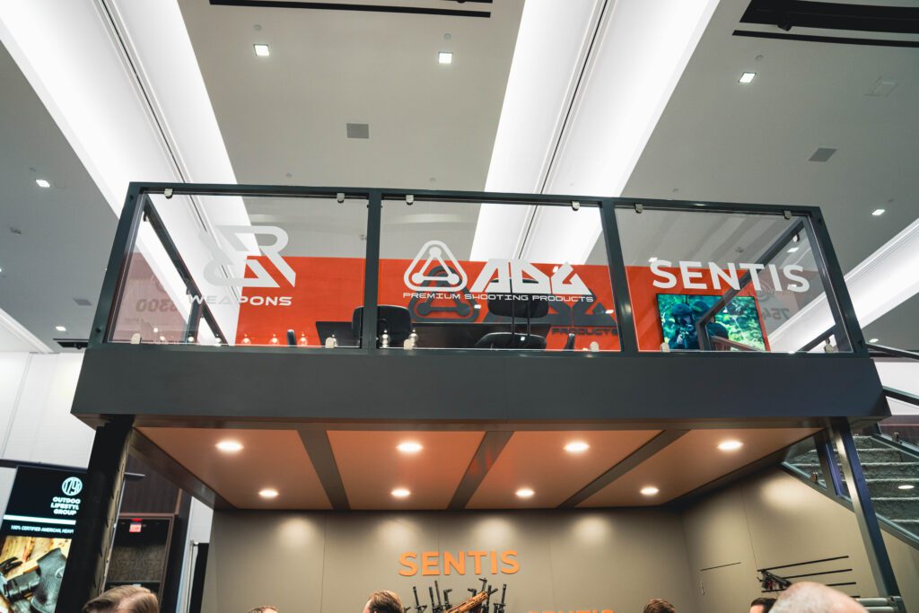 View of tall exhibit booth with signage