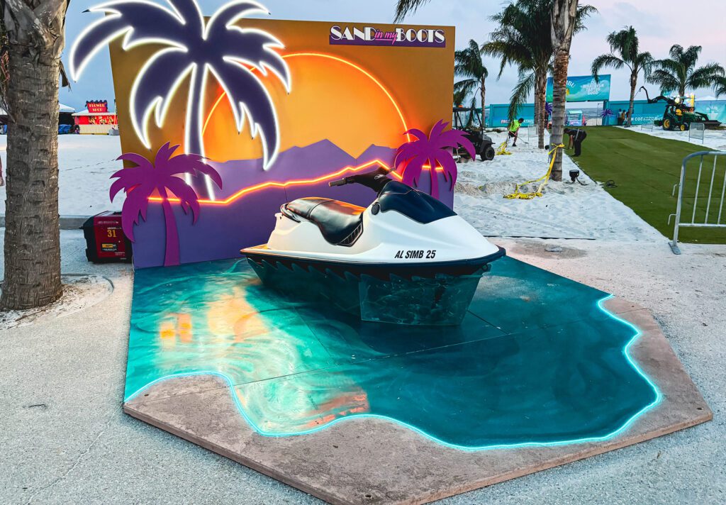 Tropical display with pool and palm backdrop