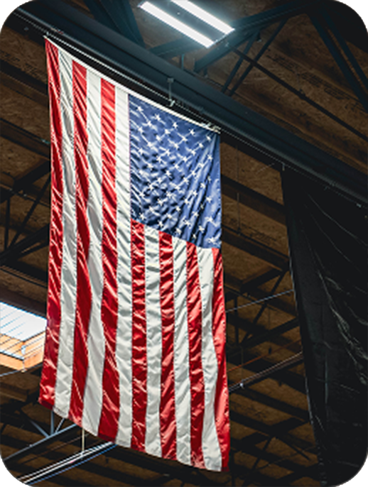 American flag hanging from ceiling in workshop