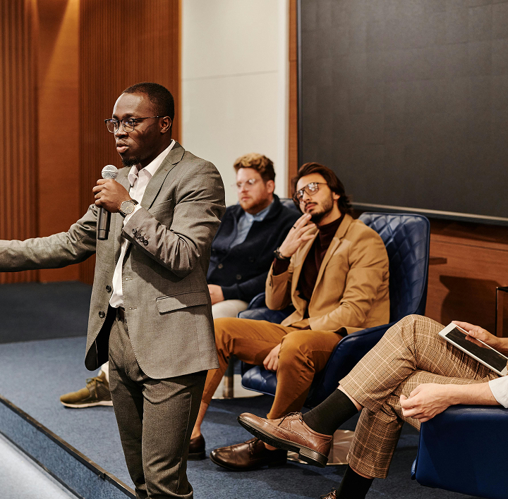 Man presenting to audience in classroom