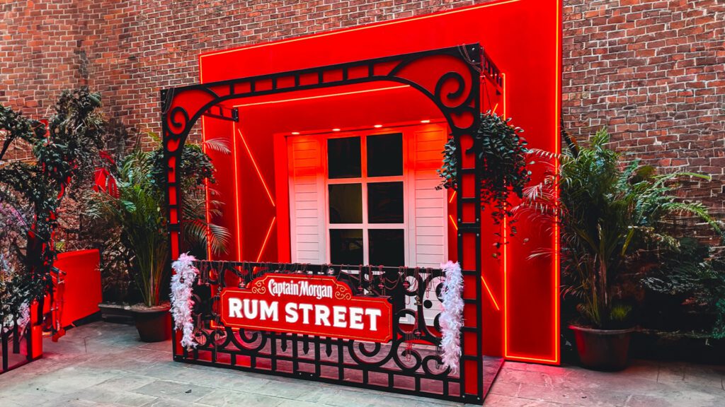 Entrance to Captain Morgan Rum Street activation with branded barricade and plants