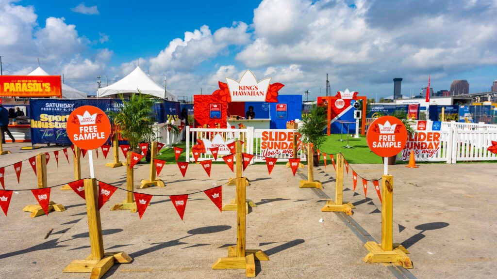 Fans posing with food and drinks at Captain Morgan and King’s Hawaiian Super Bowl activation