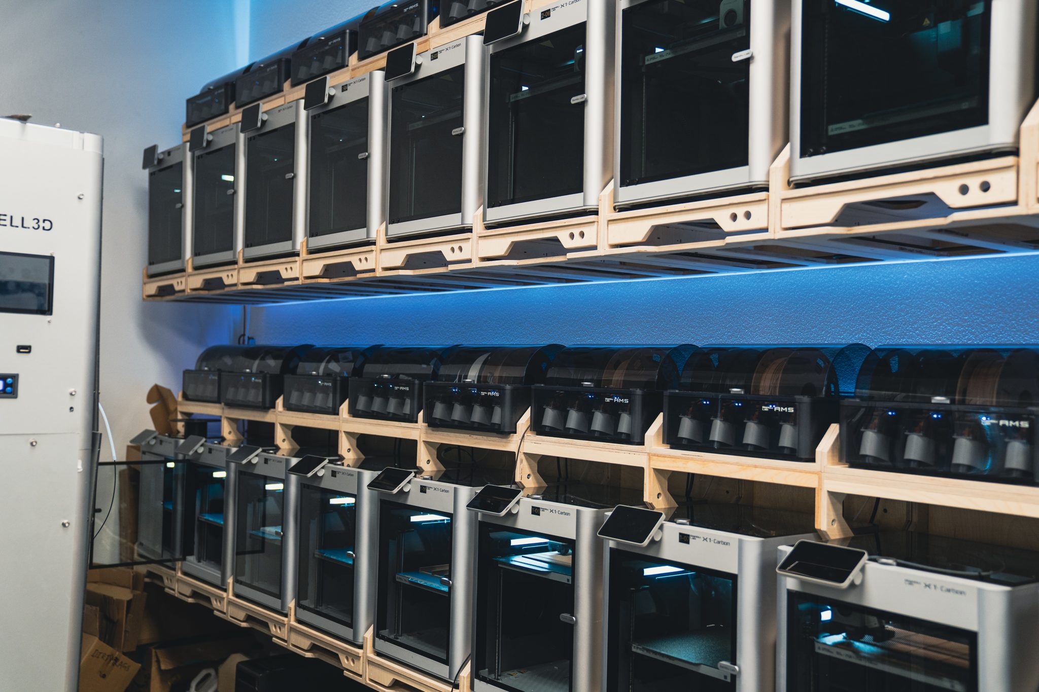 Rows of 3D printers producing exhibit and display components