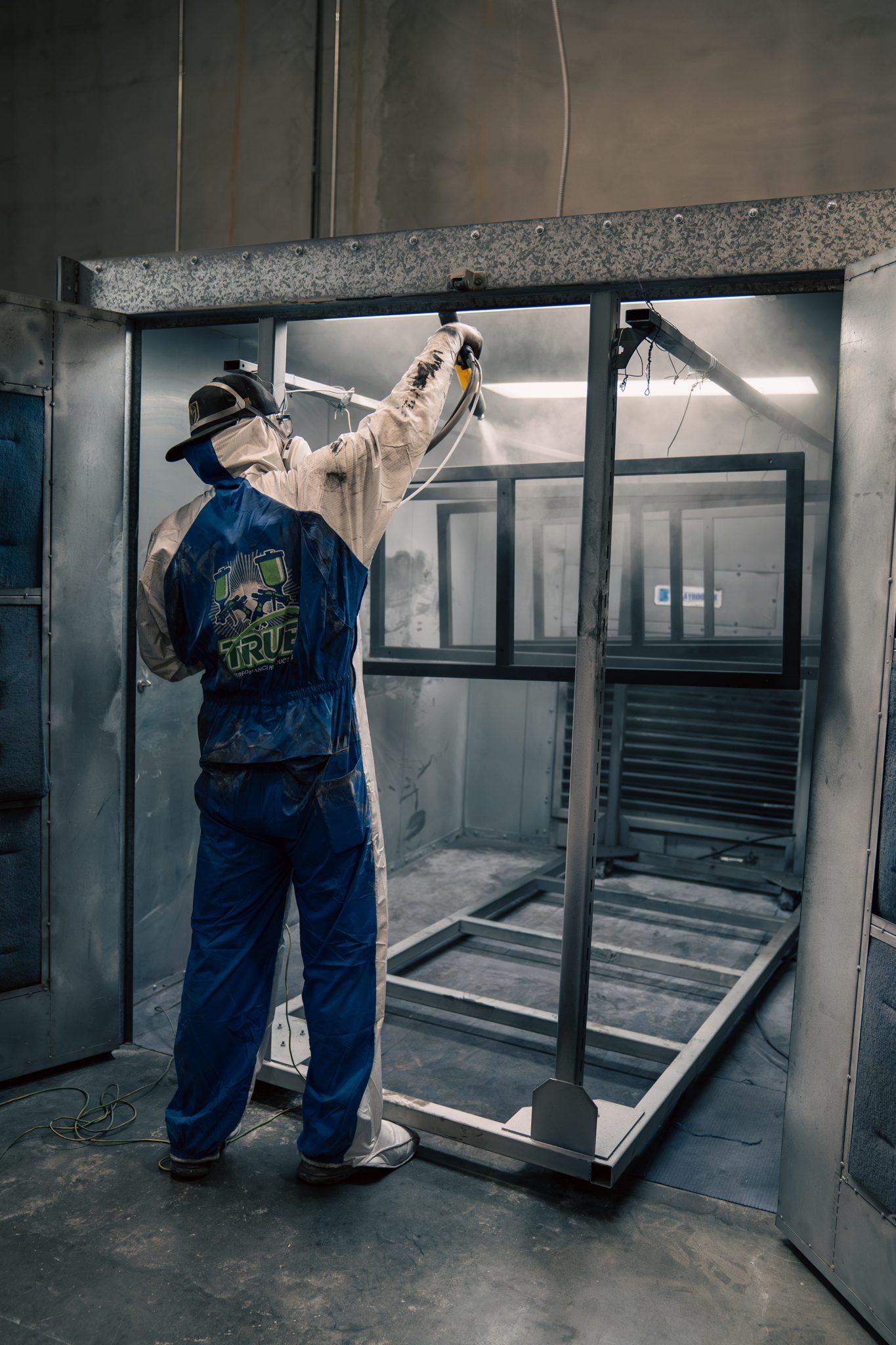 Steel display frame receiving its powder finish