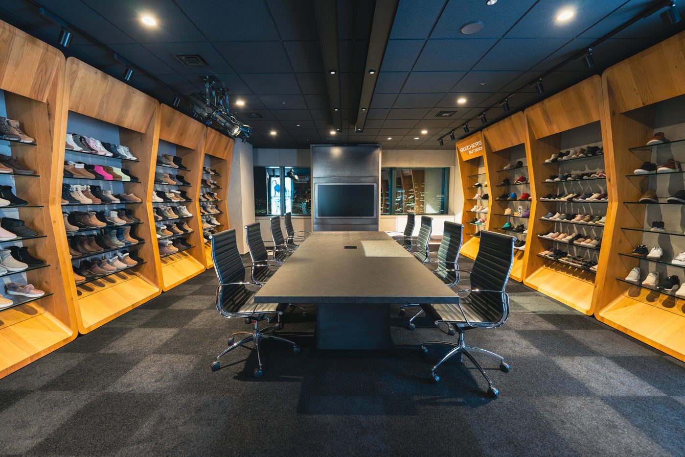 Skechers corporate showroom with custom millwork and product walls by Steadfast Displays