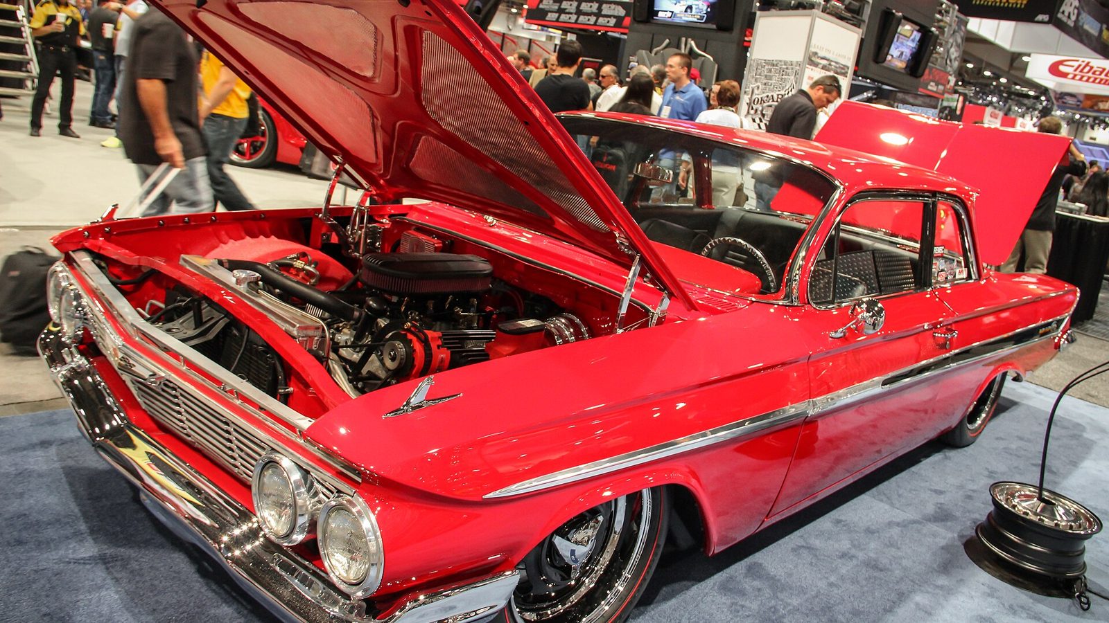 Classic car with hood open in a SEMA Show booth in the Central Hall